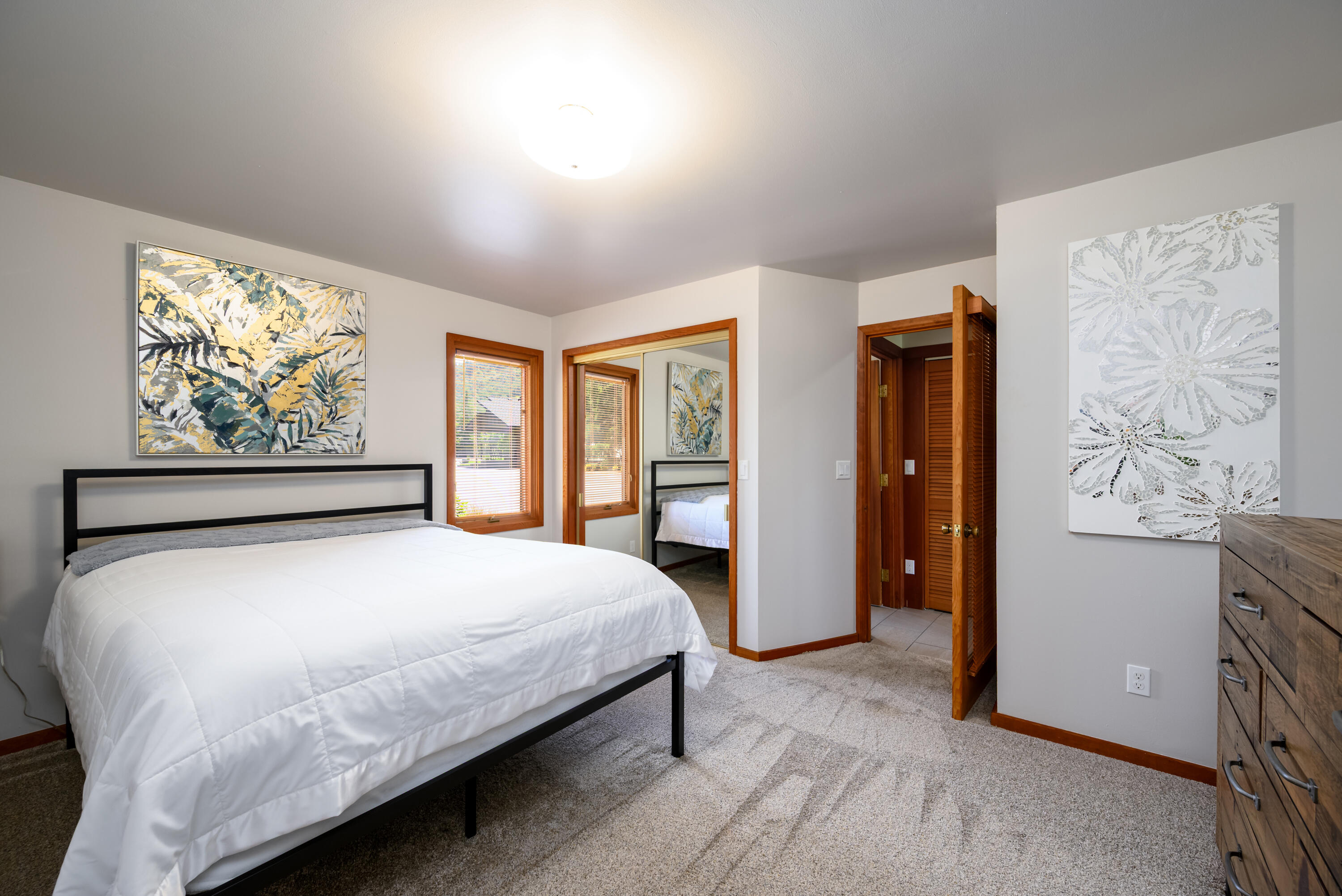 2546 Fisher Road Roseburg, OR 97471 - Photo 23 of 59 a bedroom with a large bed a painting on the wall and a large window