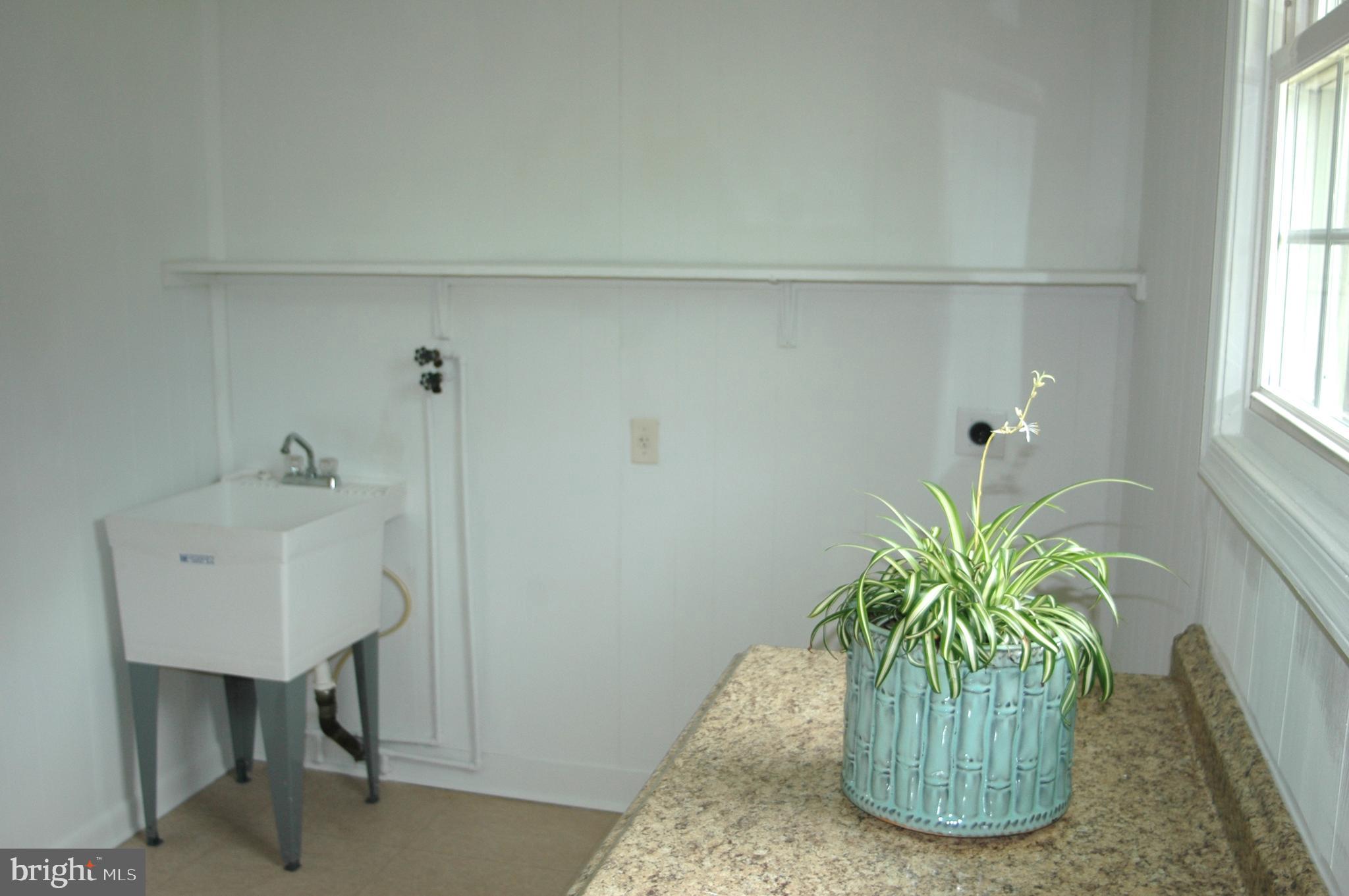 251 Scrabble Road Castleton, VA 22716 - Photo 14 of 23 a close view of chair and potted plant in a bathroom