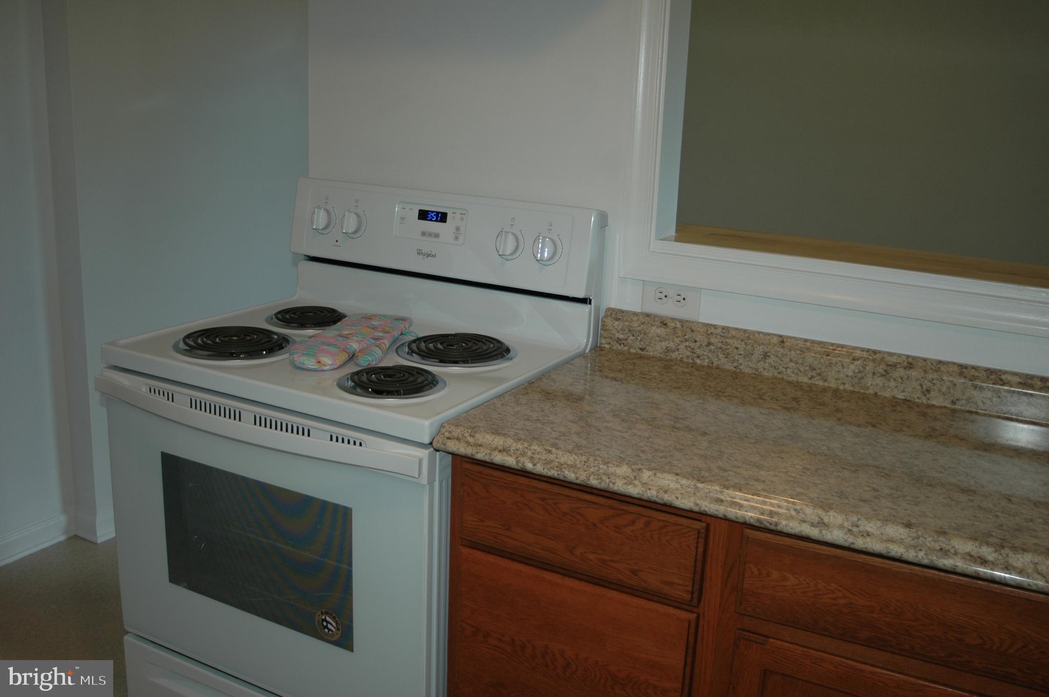 251 Scrabble Road Castleton, VA 22716 - Photo 7 of 23 a kitchen with a stove and a microwave