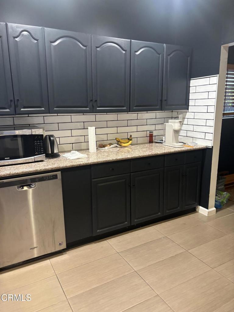 4517 Amber Place Los Angeles, CA 90032 - Photo 5 of 6 a kitchen with stainless steel appliances granite countertop a sink and cabinets
