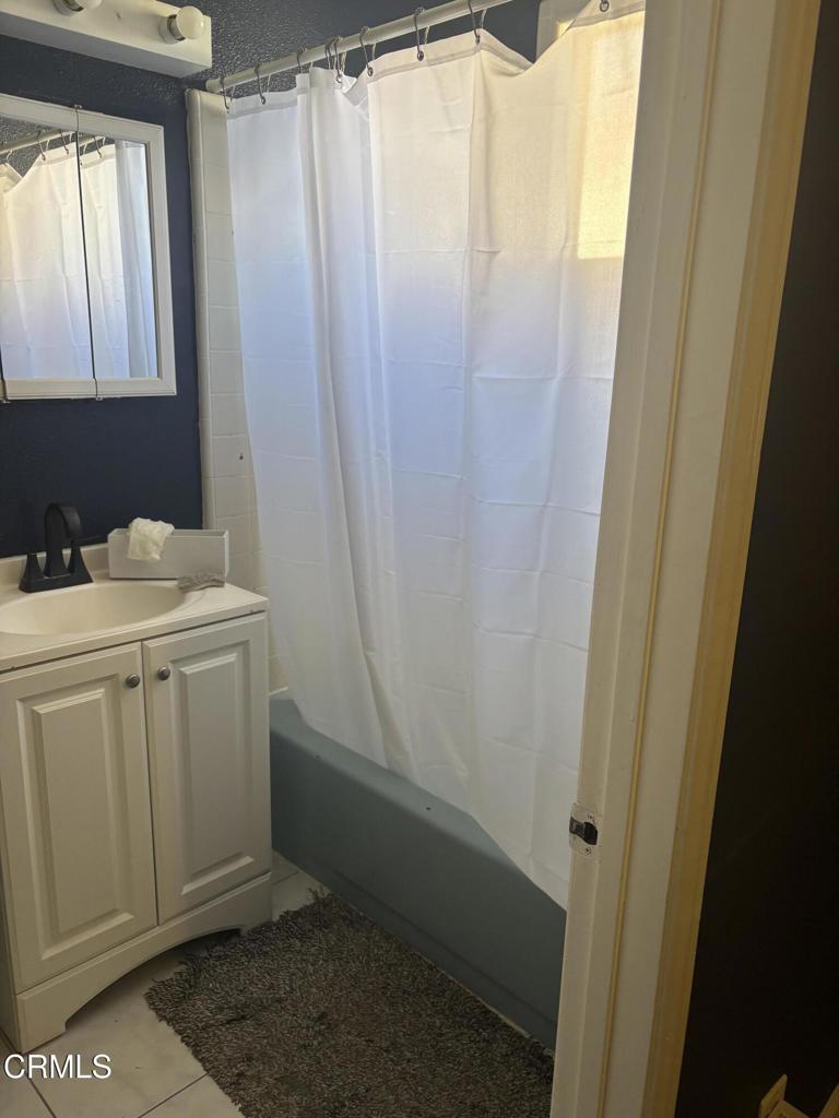 4517 Amber Place Los Angeles, CA 90032 - Photo 6 of 6 a bathroom with a sink and mirror