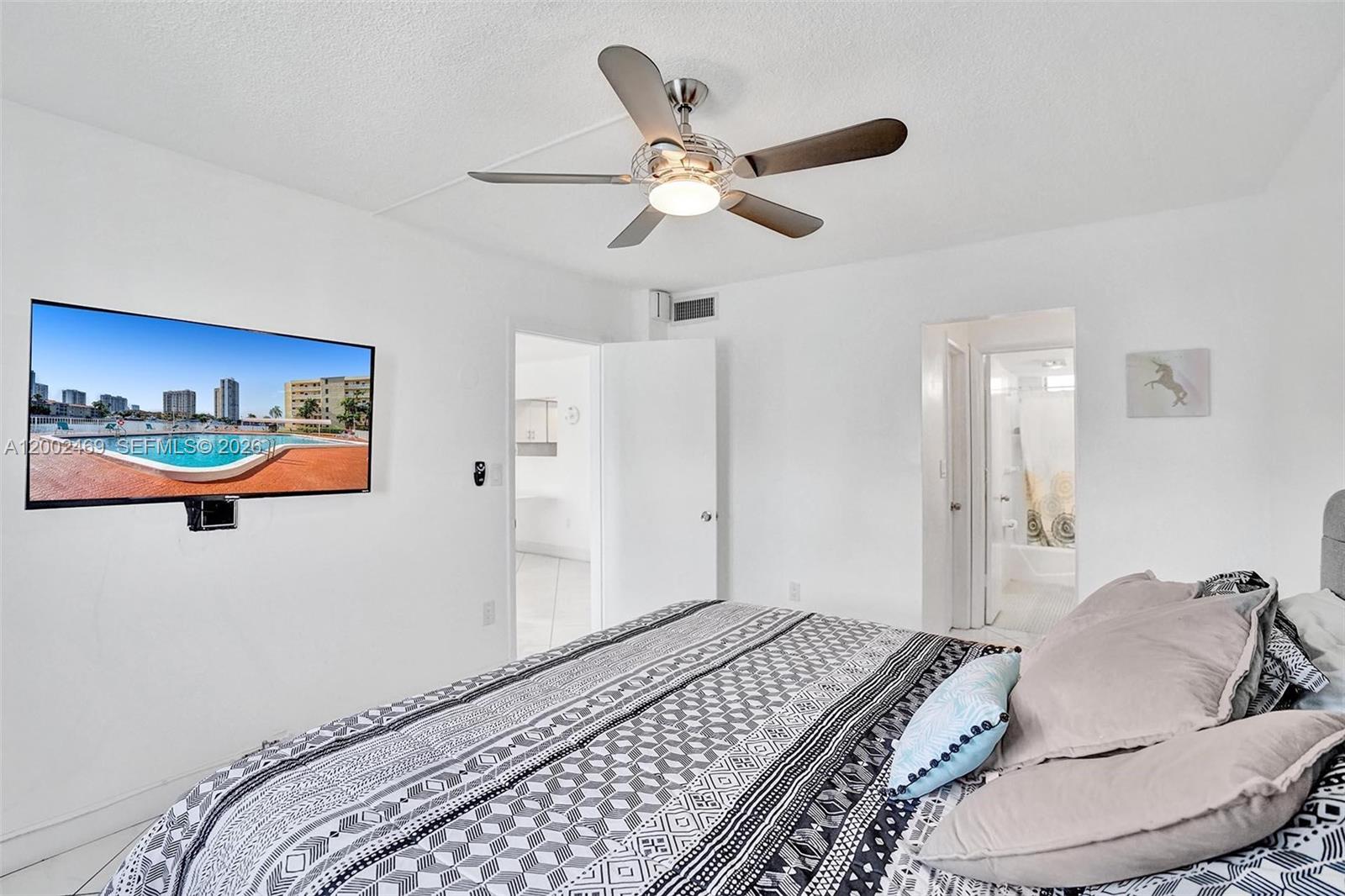 2999 Point E Drive, Unit C511 Aventura, FL 33160 - Photo 20 of 33 a bedroom with bed and a window