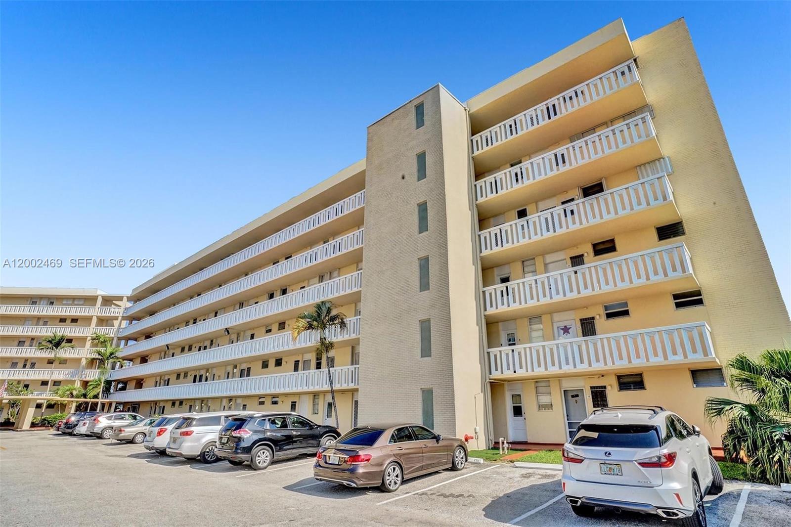 2999 Point E Drive, Unit C511 Aventura, FL 33160 - Photo 32 of 33 front view of a building with a street