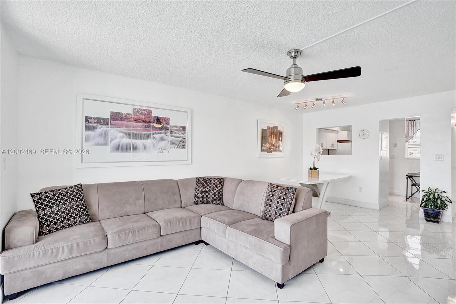 2999 Point E Drive, Unit C511 Aventura, FL 33160 - Photo 5 of 33 a living room with furniture and a couch