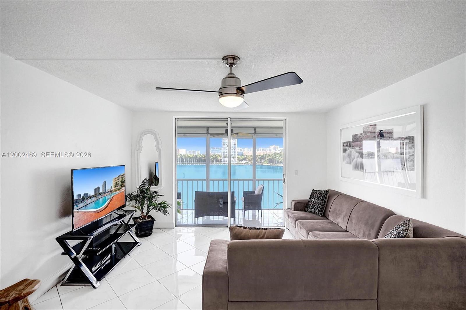 2999 Point E Drive, Unit C511 Aventura, FL 33160 - Photo 7 of 33 a living room with furniture and a flat screen tv