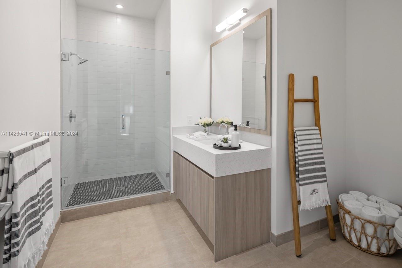 2800 Southwest 27th Terrace, Unit 616 Miami, FL 33133 - Photo 5 of 14 a bathroom with a sink a toilet and shower