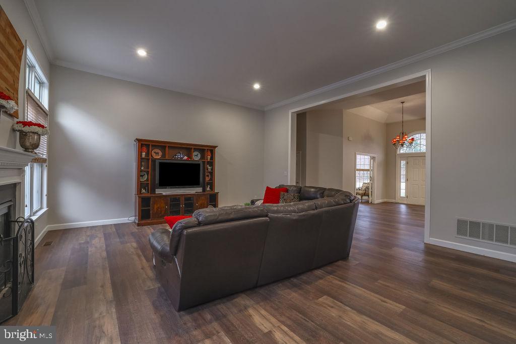 5 Popper Street Manahawkin, NJ 08050 - Photo 12 of 74 a living room with furniture and a flat screen tv