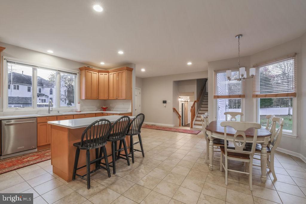 5 Popper Street Manahawkin, NJ 08050 - Photo 14 of 74 a kitchen with a dining table chairs and large windows