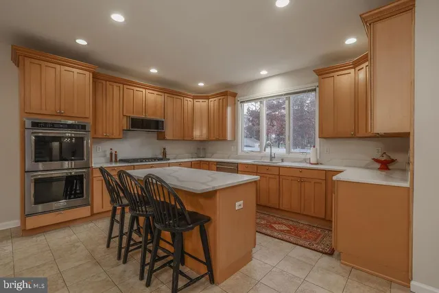 a bathroom with a sink toilet and a mirror
