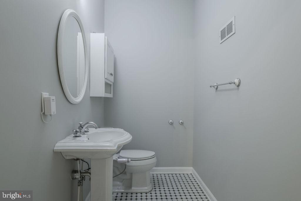 5 Popper Street Manahawkin, NJ 08050 - Photo 20 of 74 a bathroom with a sink toilet and a mirror