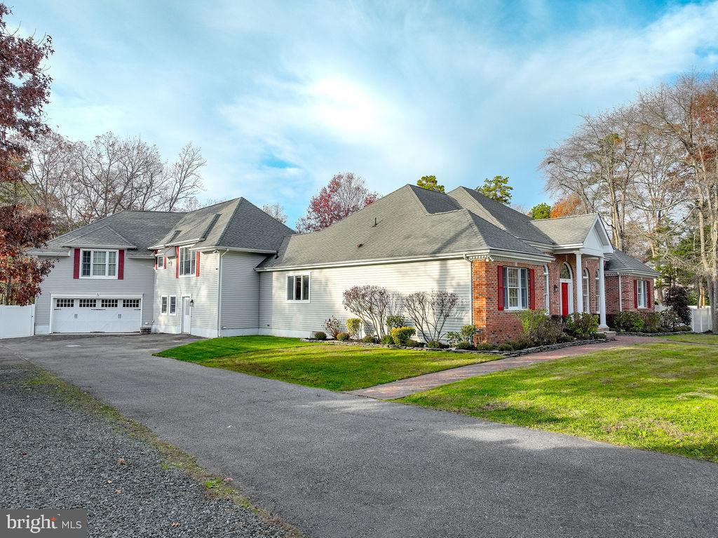 5 Popper Street Manahawkin, NJ 08050 - Photo 2 of 74 a front view of house with yard and green space