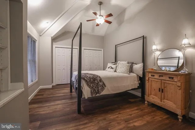 a bed room with a bed window and a couch