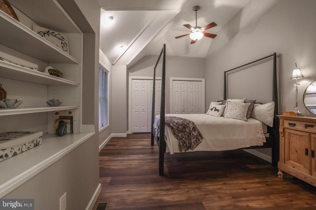 5 Popper Street Manahawkin, NJ 08050 - Photo 27 of 74 a bedroom with a bed and a chandelier