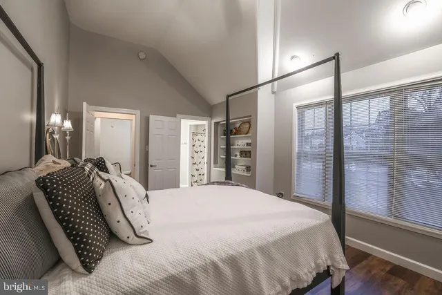 a view of a livingroom with furniture and chandelier fan