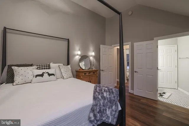 a spacious bathroom with a tub sink and mirror