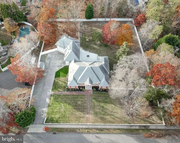 an aerial view of a house with outdoor space