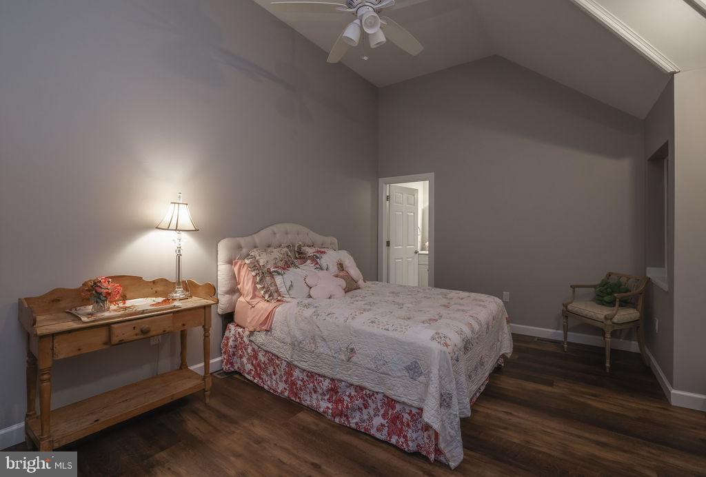 5 Popper Street Manahawkin, NJ 08050 - Photo 31 of 74 a bedroom with a bed and a lamp on the dresser