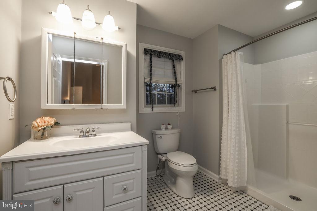 5 Popper Street Manahawkin, NJ 08050 - Photo 33 of 74 a bathroom with a sink toilet and shower