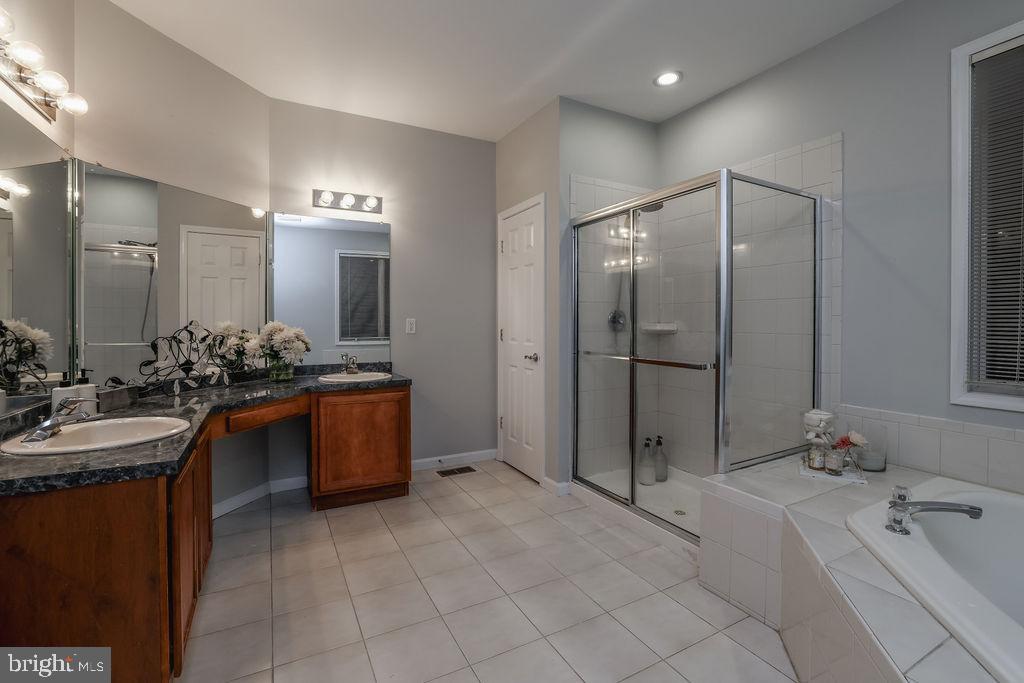 5 Popper Street Manahawkin, NJ 08050 - Photo 38 of 74 a spacious bathroom with a tub sink and mirror