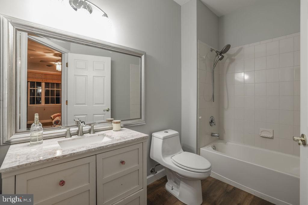 5 Popper Street Manahawkin, NJ 08050 - Photo 40 of 74 a bathroom with a granite countertop toilet a sink and a bathtub