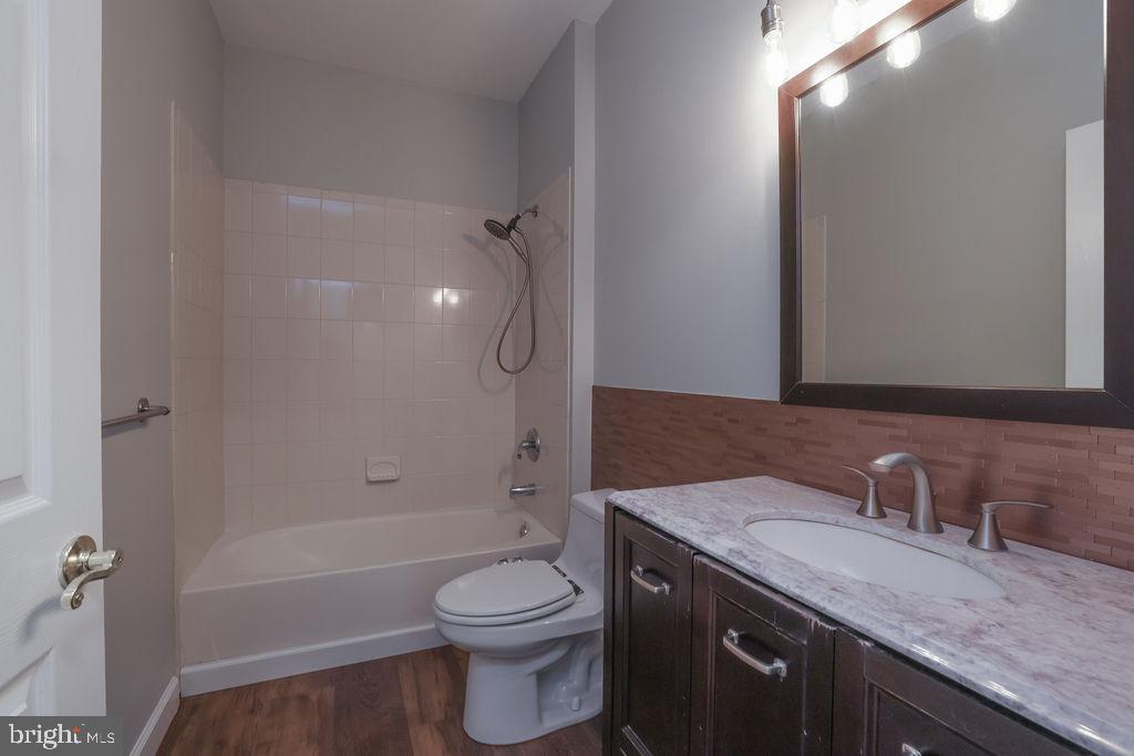 5 Popper Street Manahawkin, NJ 08050 - Photo 42 of 74 a bathroom with a granite countertop sink toilet and shower