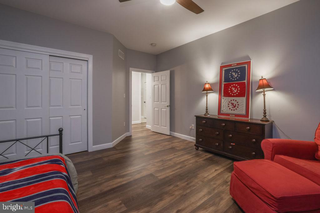 5 Popper Street Manahawkin, NJ 08050 - Photo 43 of 74 a bedroom with a bed and wooden floor