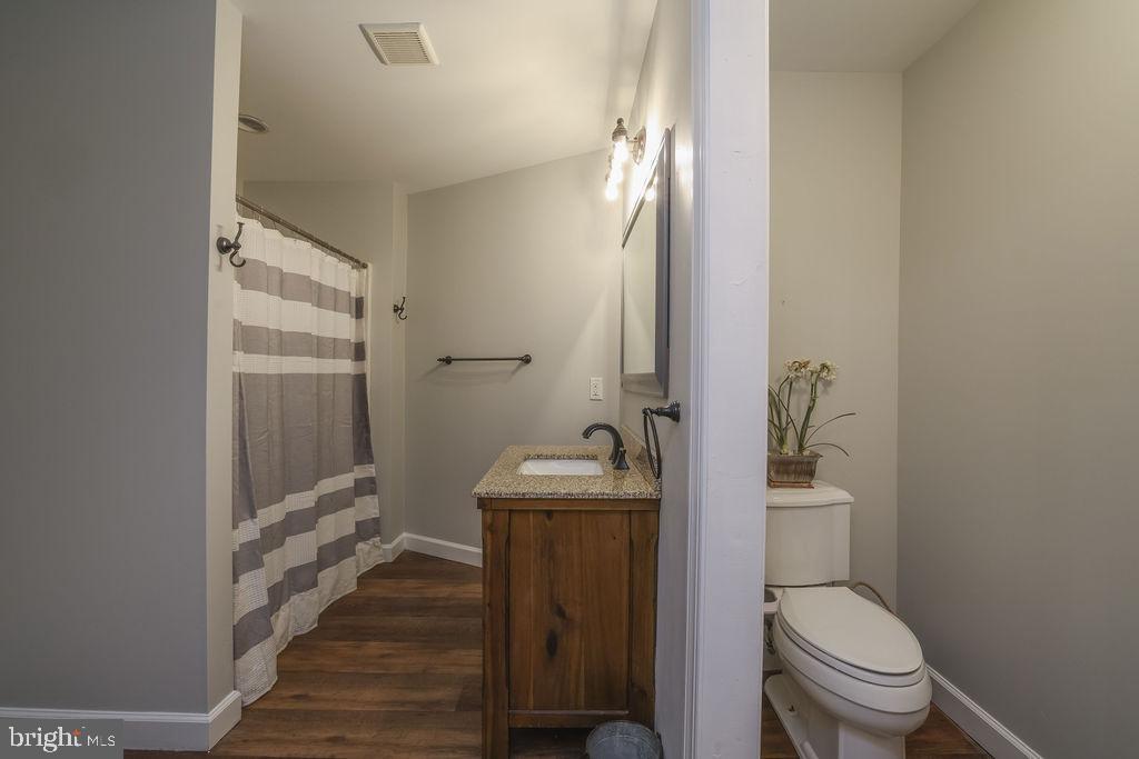 5 Popper Street Manahawkin, NJ 08050 - Photo 46 of 74 a bathroom with a sink a toilet and shower