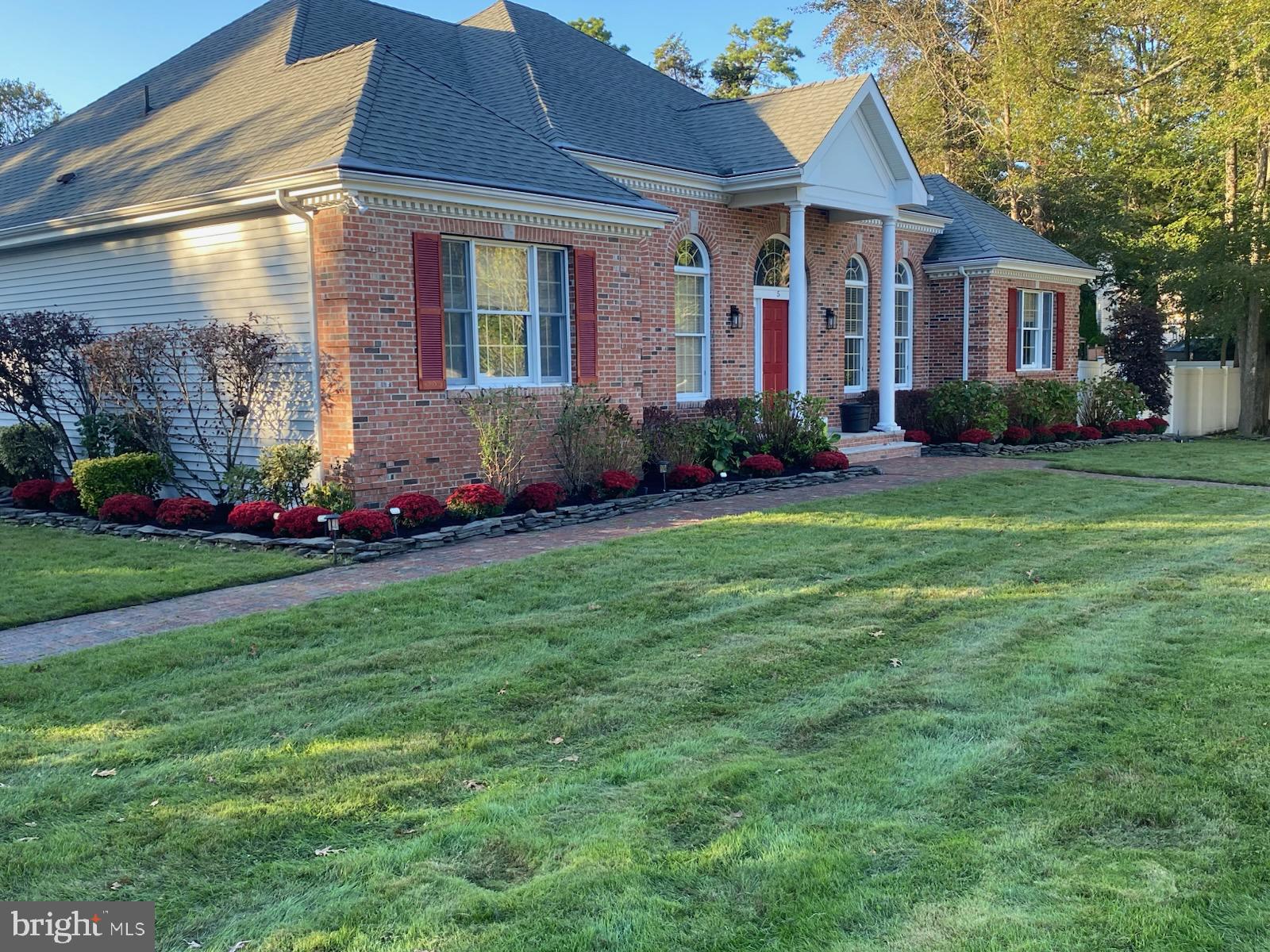 5 Popper Street Manahawkin, NJ 08050 - Photo 74 of 74 a front view of a house with garden
