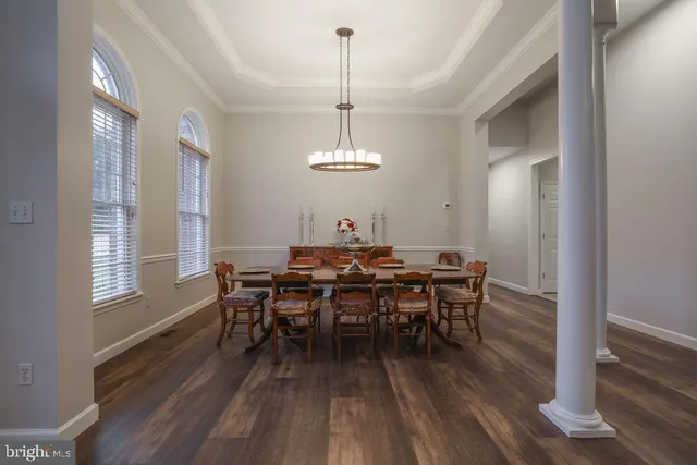 a living room with furniture or couch and a wooden floor