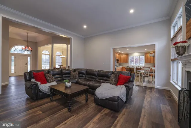 a living room with furniture window and a fireplace