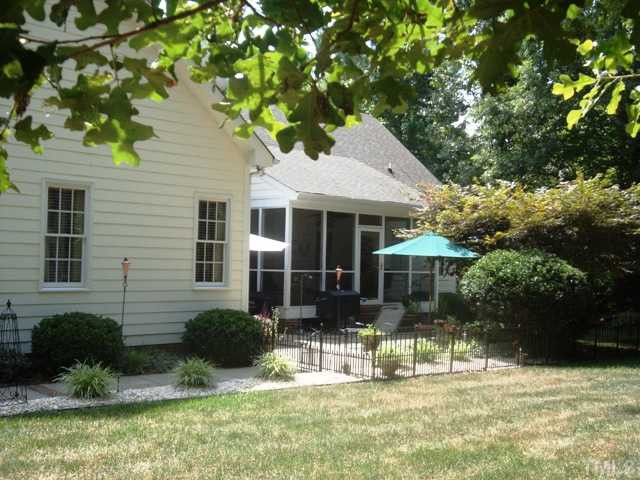2845 Anfield Road Raleigh, NC 27606 - Photo 21 of 25 View of Exterior Back with Walkway Leading to Garage/Driveway Back Yard