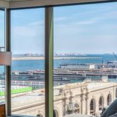 a view of a kitchen with a large window