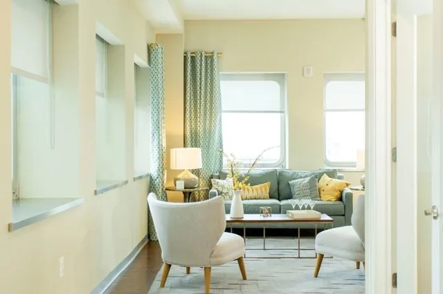 a living room with furniture and a window