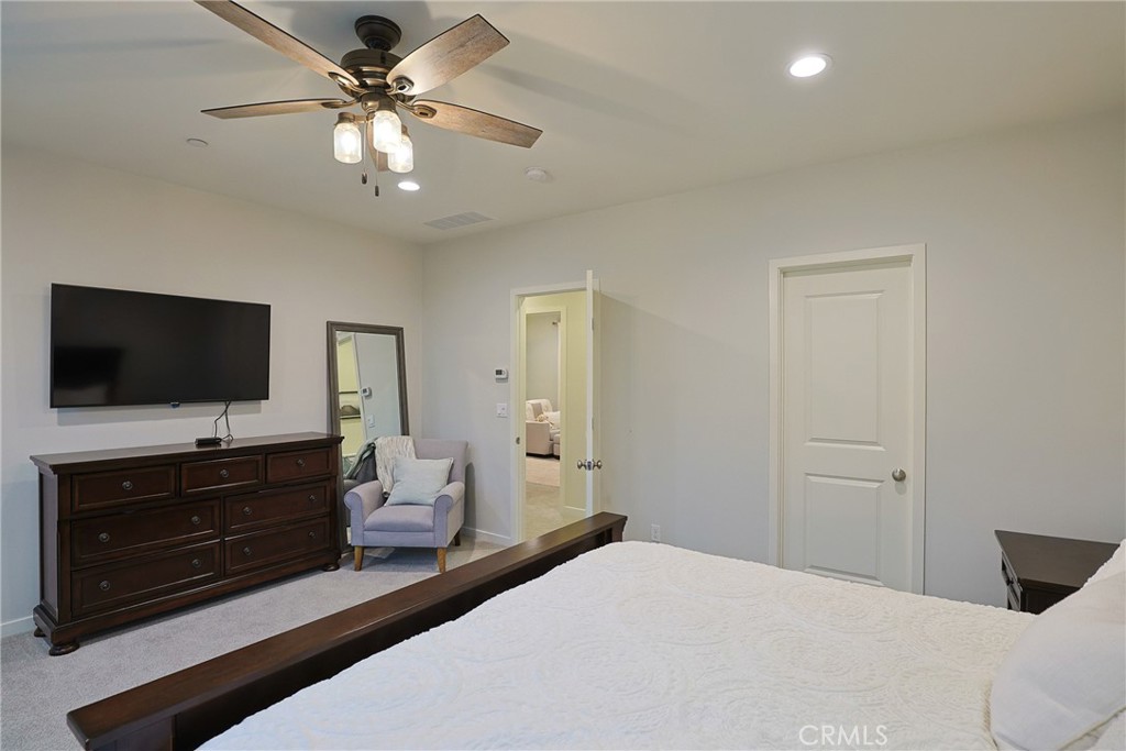 78 Kestrel Irvine, CA 92618 - Photo 11 of 32 a bedroom with a bed and a flat screen tv