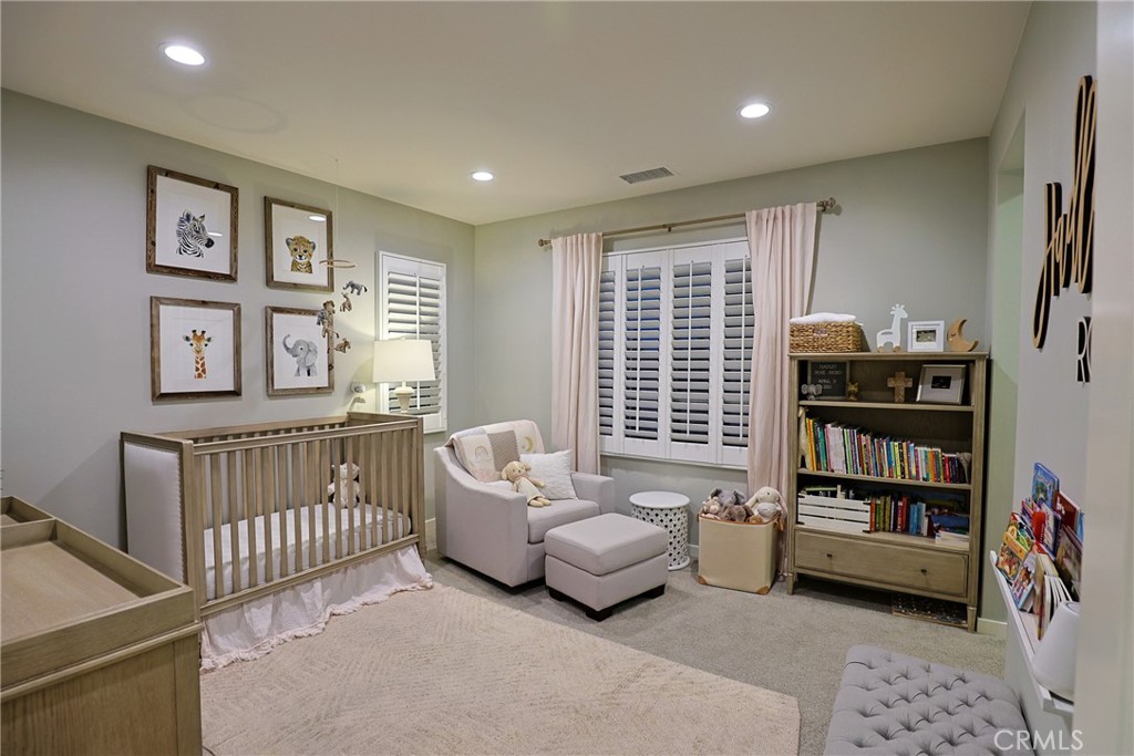 78 Kestrel Irvine, CA 92618 - Photo 12 of 32 a bedroom with furniture and a book shelf