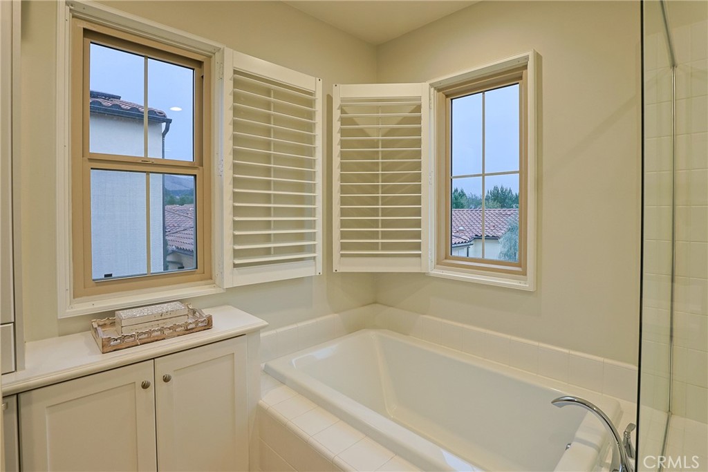 78 Kestrel Irvine, CA 92618 - Photo 17 of 32 a bathroom with a bathtub and a sink