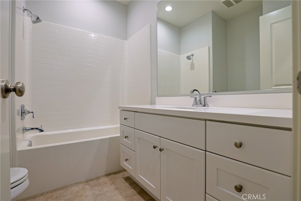 78 Kestrel Irvine, CA 92618 - Photo 19 of 32 a bathroom with a sink double vanity and bathtub