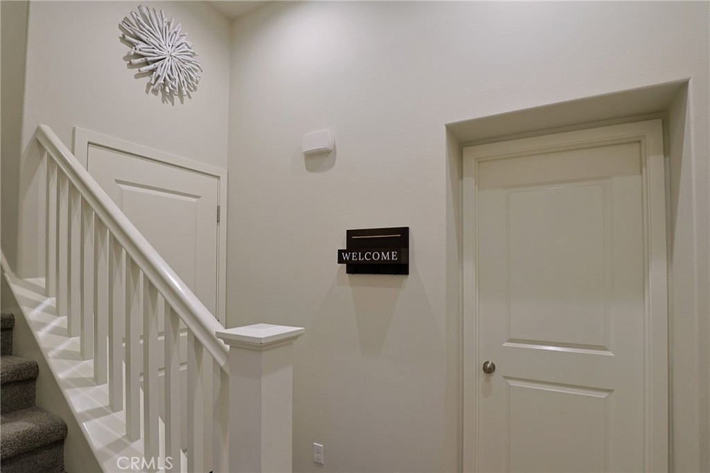 78 Kestrel Irvine, CA 92618 - Photo 23 of 32 a view of a hallway with stairs
