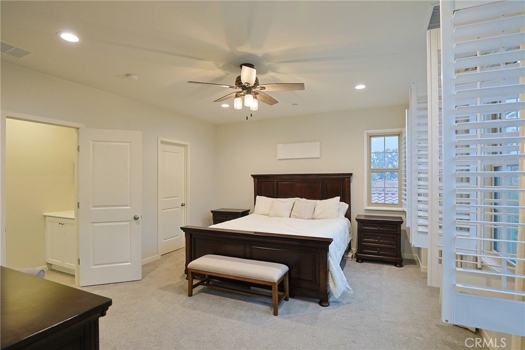 78 Kestrel Irvine, CA 92618 - Photo 4 of 32 a bedroom with a bed and a chandelier