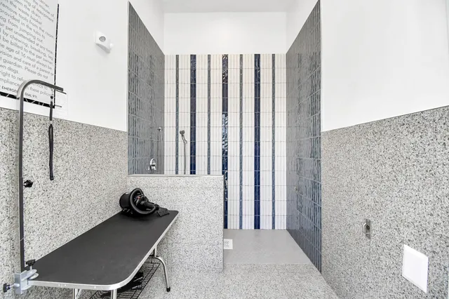 a view of a bathroom with a tub and shower