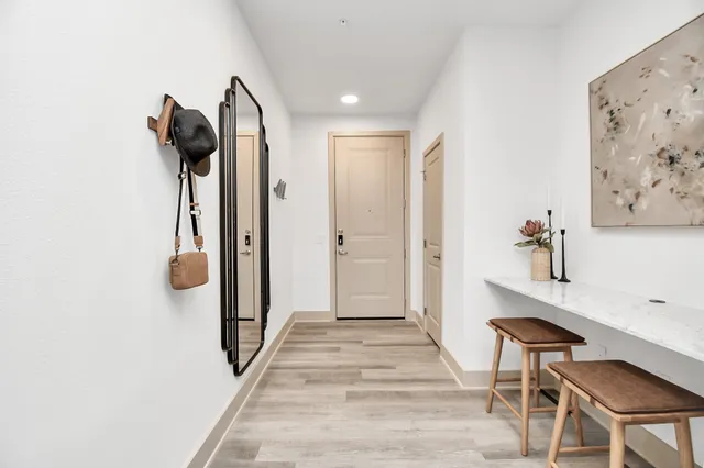 a view of a hallway with seating area