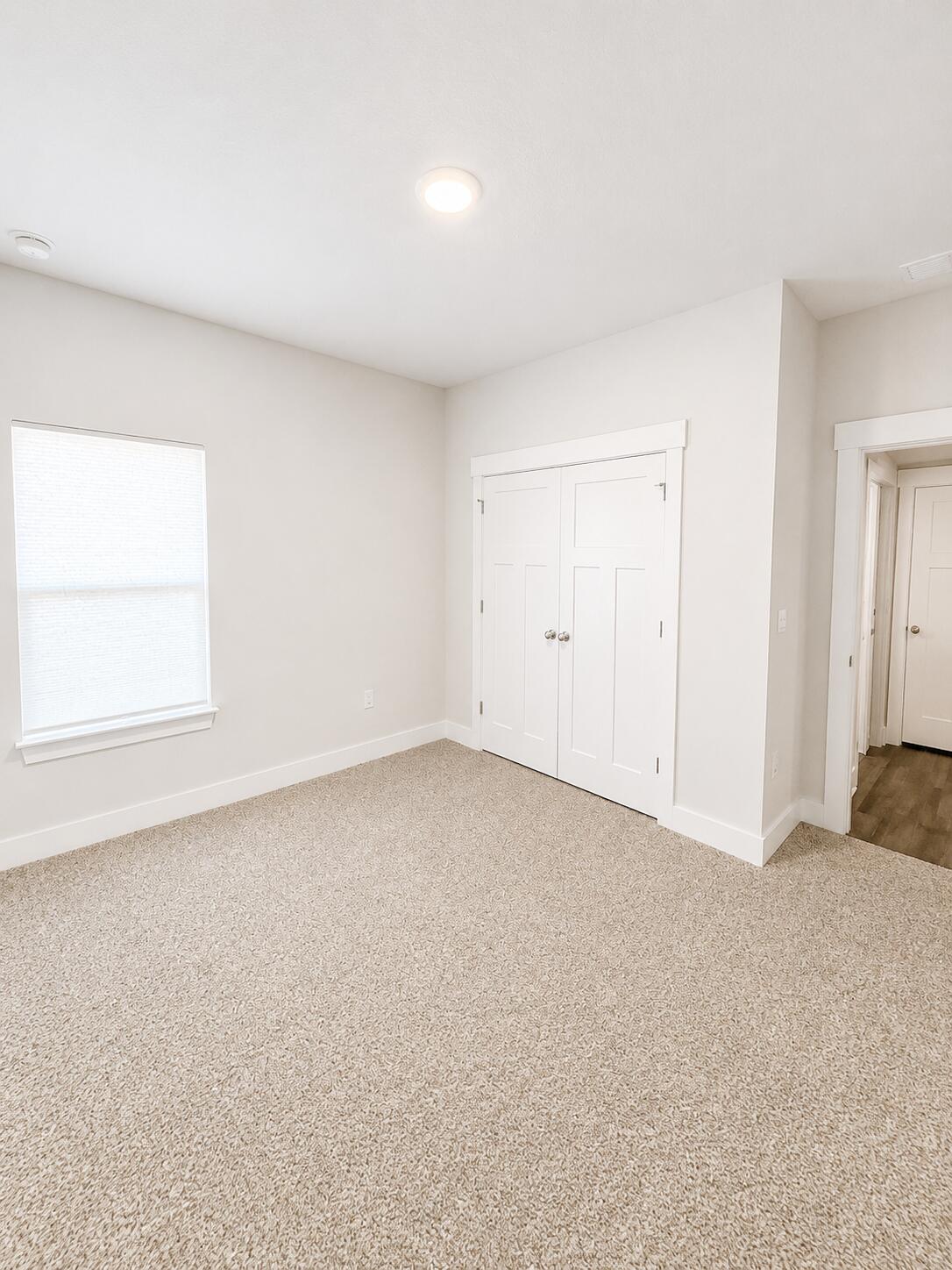 734 Quintana Street Crestview, FL 32539 - Photo 6 of 16 an empty room with a window