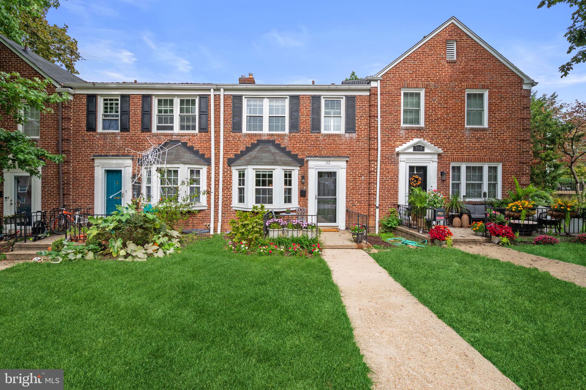 112 Regester Avenue Baltimore, MD 21212 - Photo 1 of 36 a front view of a house with a yard