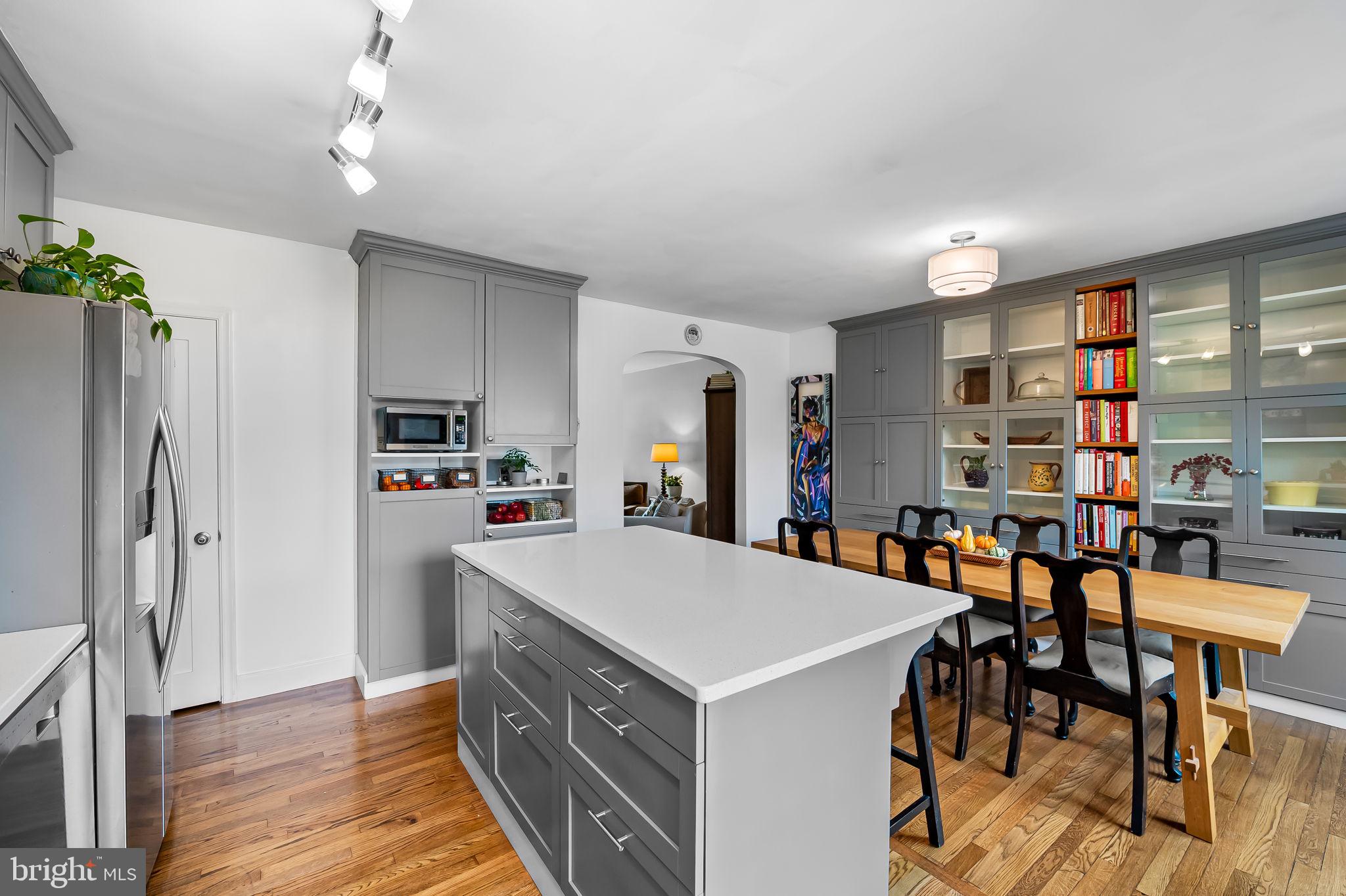 112 Regester Avenue Baltimore, MD 21212 - Photo 11 of 36 a view of kitchen with cabinets and wooden floor