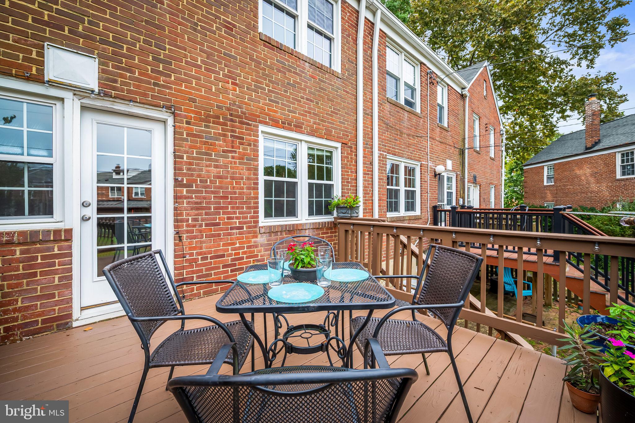 112 Regester Avenue Baltimore, MD 21212 - Photo 15 of 36 a view of a patio with table and chairs and potted plants