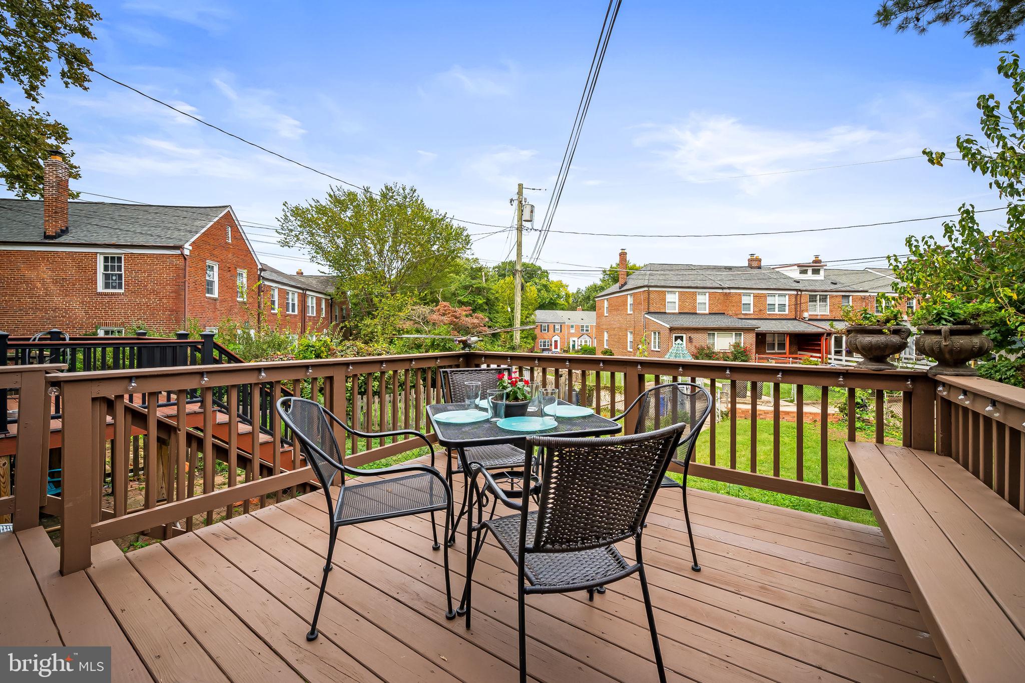 112 Regester Avenue Baltimore, MD 21212 - Photo 16 of 36 a view of a roof deck with table and chairs
