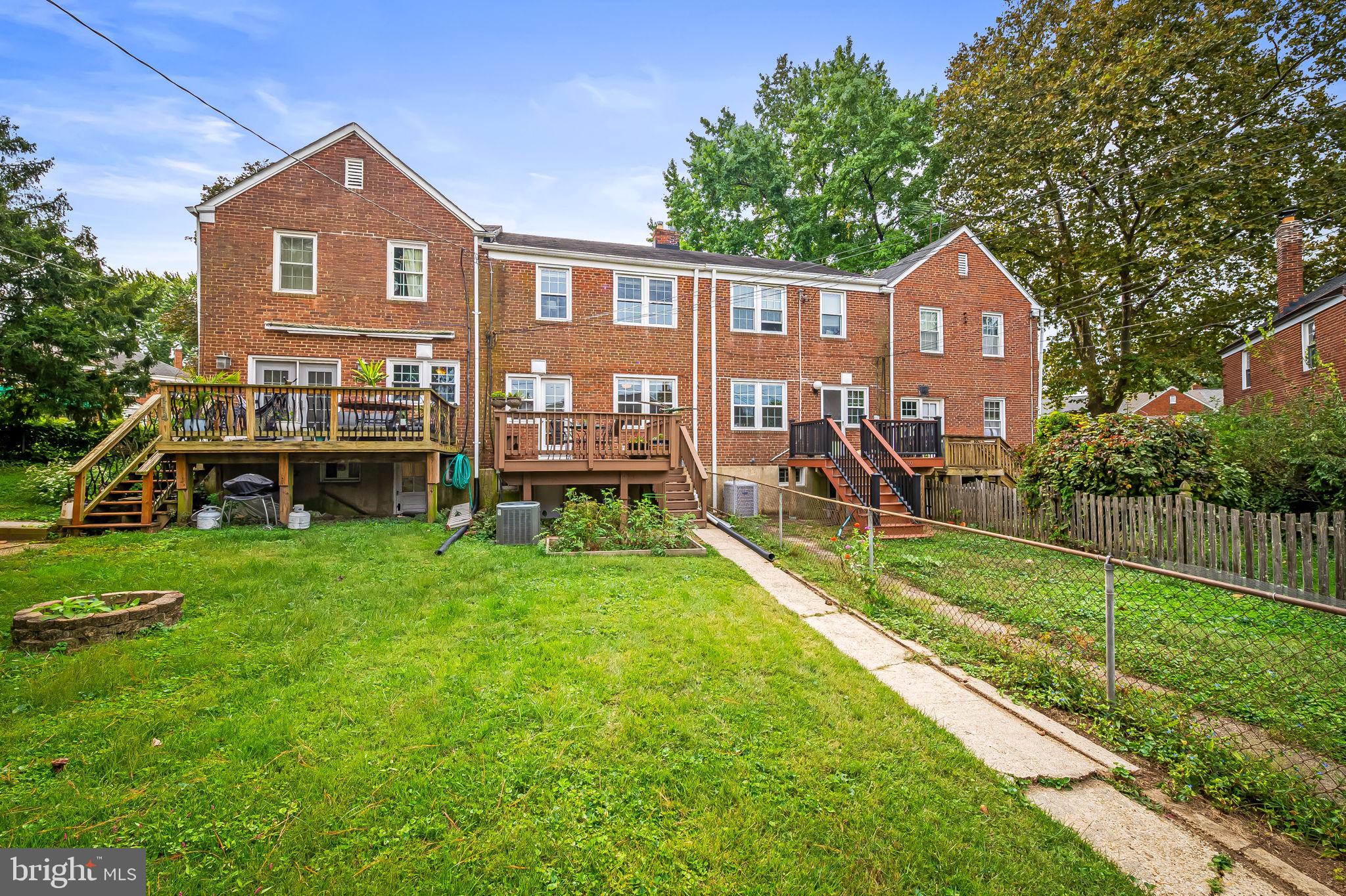 112 Regester Avenue Baltimore, MD 21212 - Photo 18 of 36 a front view of a house with a yard table and chairs
