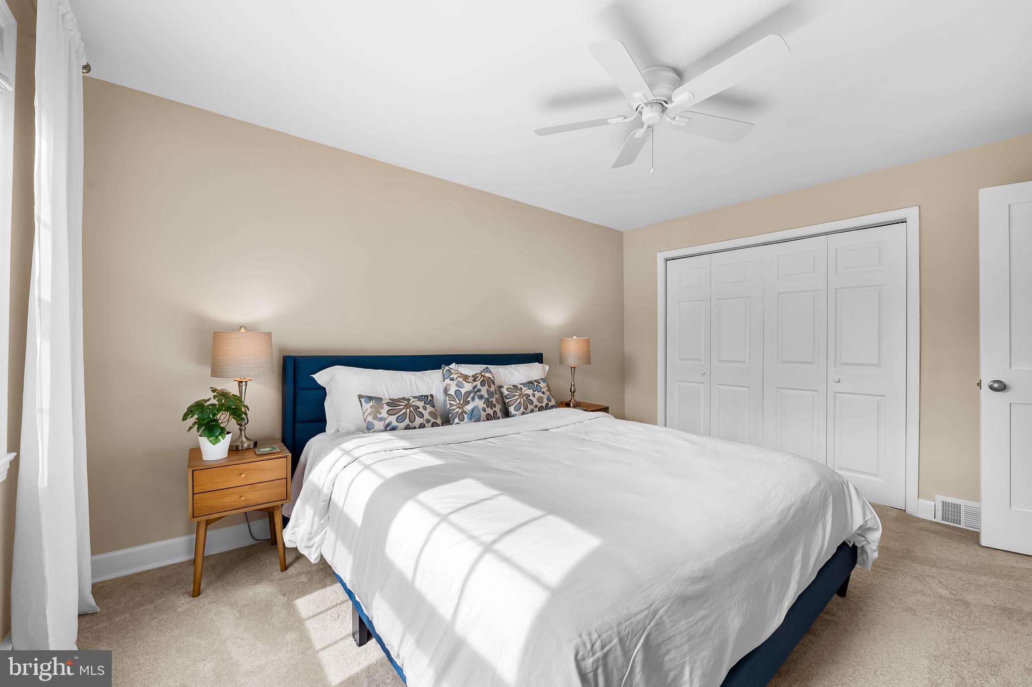 112 Regester Avenue Baltimore, MD 21212 - Photo 21 of 36 a bedroom with a bed and a ceiling fan