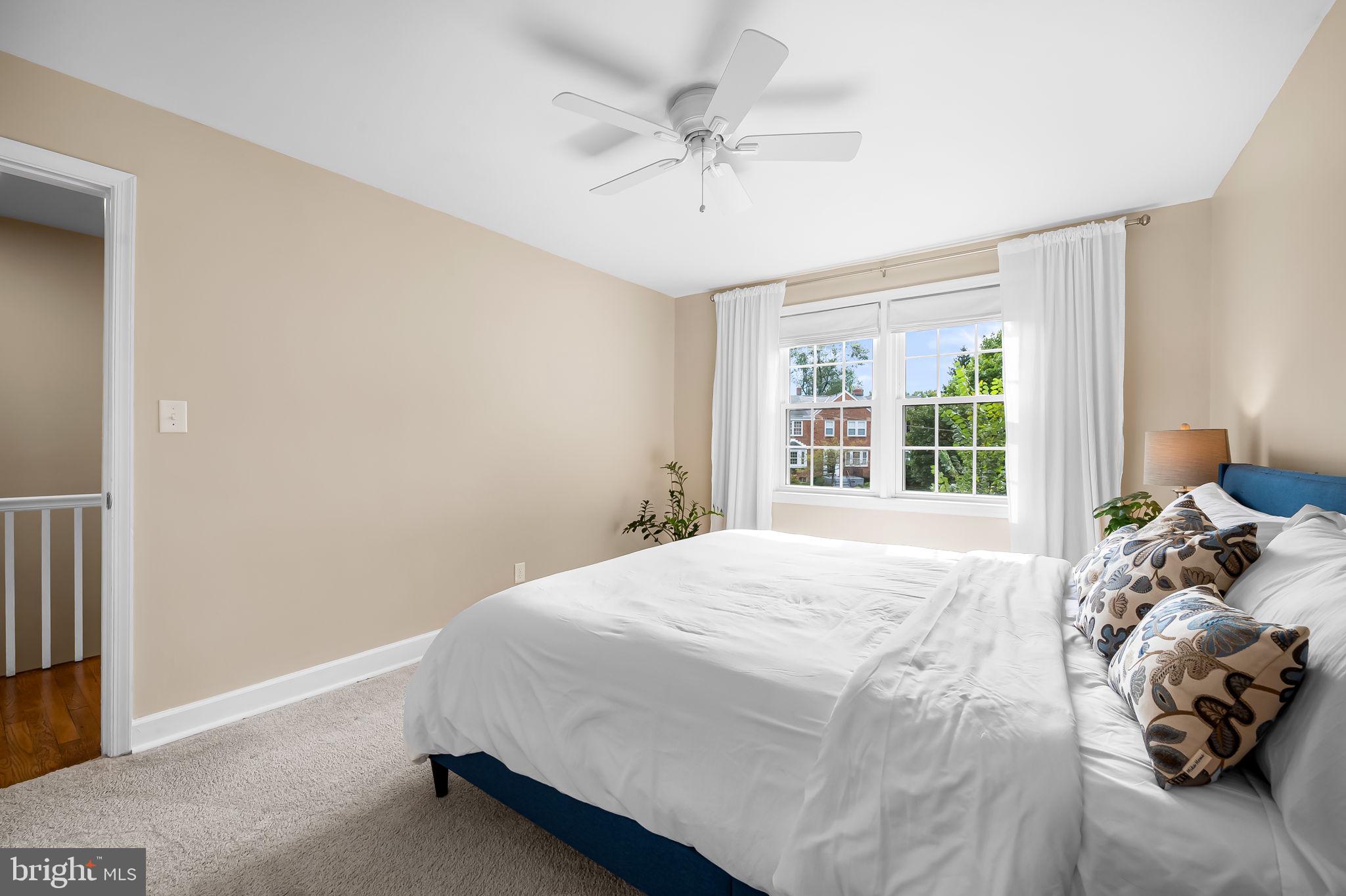 112 Regester Avenue Baltimore, MD 21212 - Photo 22 of 36 a bedroom with a bed and window
