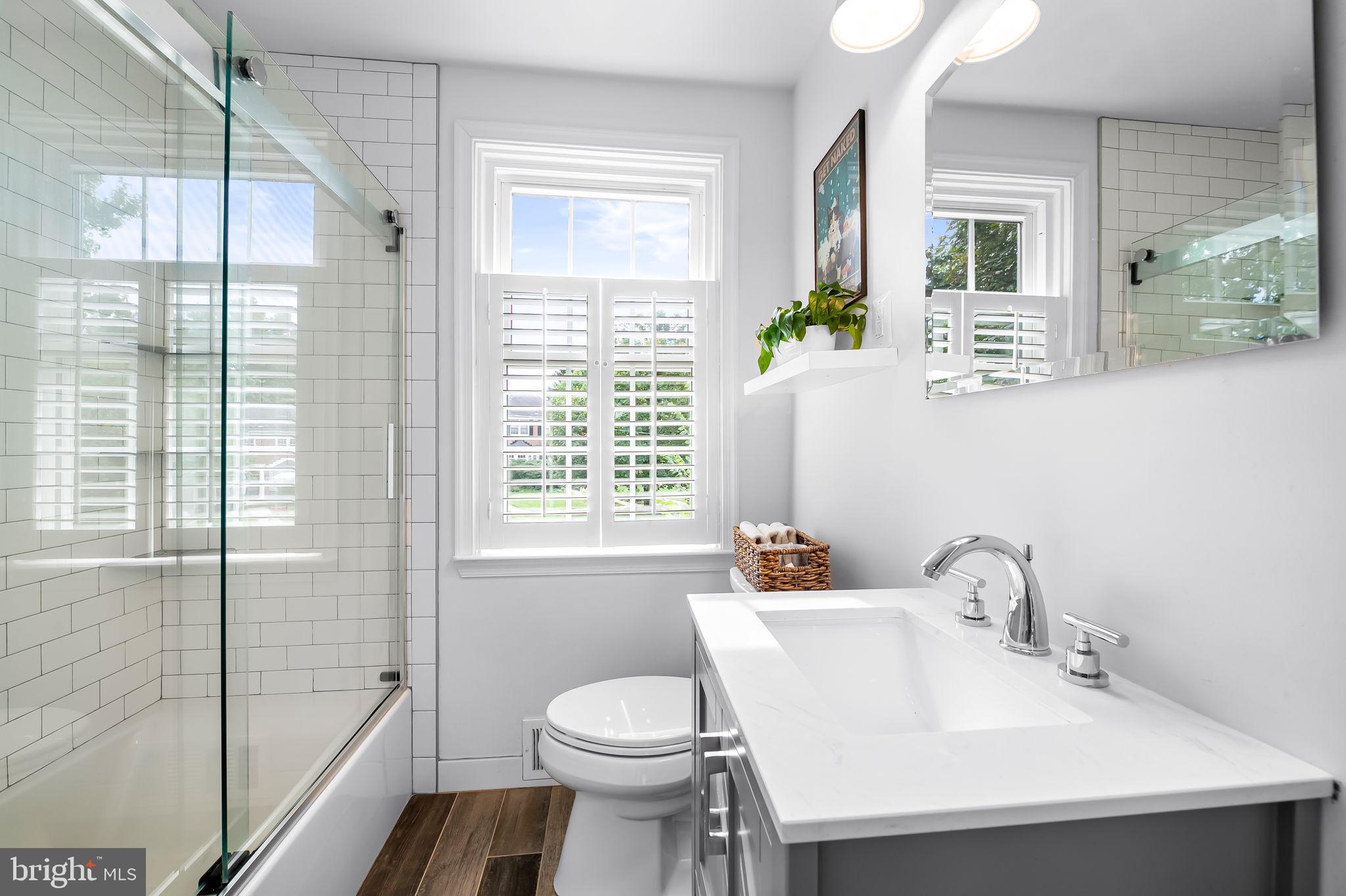 112 Regester Avenue Baltimore, MD 21212 - Photo 24 of 36 a bathroom with a sink a toilet and shower